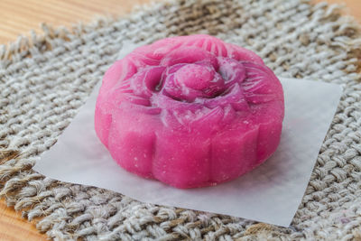 High angle view of pink cake on table