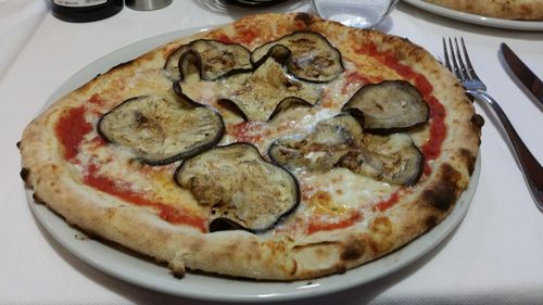 High angle view of pizza in plate on table