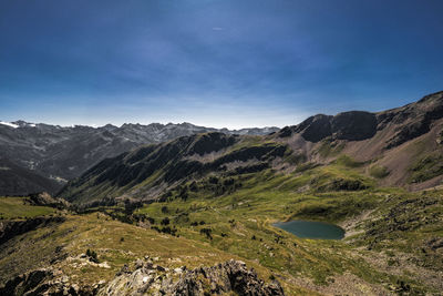 Scenic view of landscape and mountains against sky