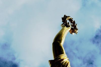 Low angle view of statue against sky