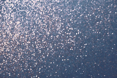 Full frame shot of snowflakes on glass