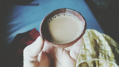 Close-up of woman holding indian masala chai drink