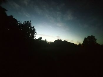 Silhouette trees against sky