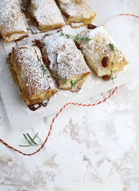 Phyllo dough rolls with apples and orange marmalade.