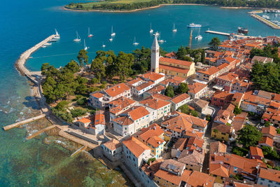 High angle view of townscape by sea