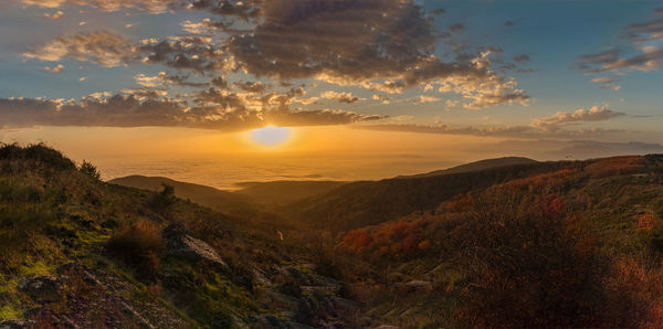 Scenic view of landscape against sky during sunset