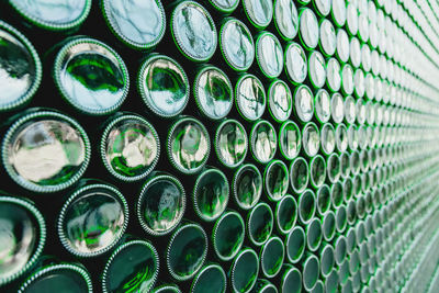 Glass bottles green. green glass bottles of beer. wall formed by green bottles. green bottles