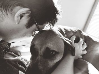 Close-up of boy with dog