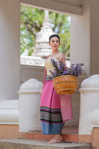 Woman standing in front of building