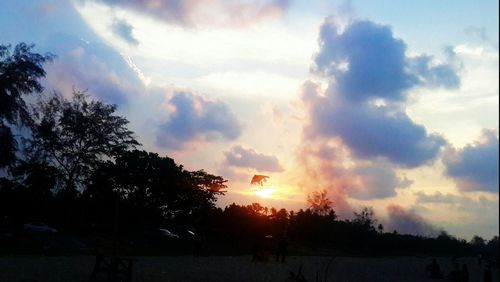 Scenic view of landscape against sky at sunset