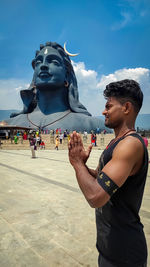 Man standing statue against sky