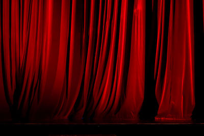 Red curtain on empty stage