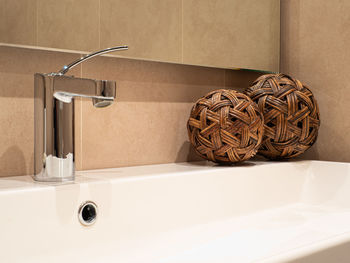 Close-up of faucet in bathroom