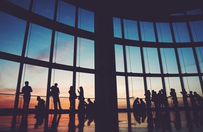 Silhouette of business people in corridor of office building