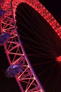 Low angle view of illuminated ferris wheel