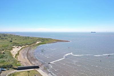 Scenic view of sea against clear blue sky