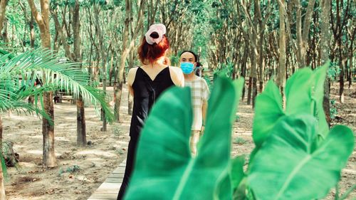 Woman standing in a forest