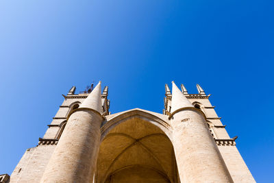 Low angle view of traditional building against clear blue sky