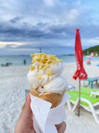 Close-up of hand holding ice cream