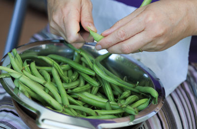 Close-up of hand holding vegetables