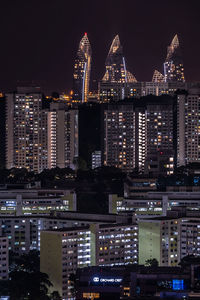 Illuminated buildings in city at night