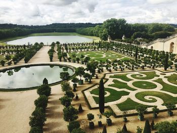 High angle view of formal garden against sky
