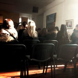 Group of people sitting in kitchen