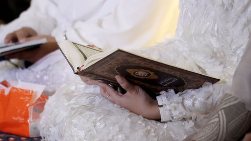 Close-up of woman hand holding book