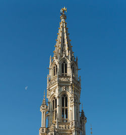 Low angle view of traditional building against blue sky