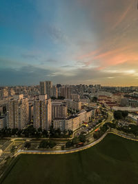 High angle view of buildings in city against sky during sunset