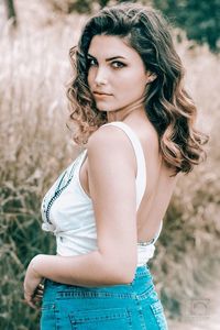 Portrait of a beautiful young woman standing outdoors