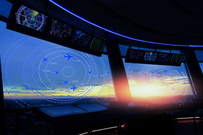 Close-up of illuminated airplane in airport