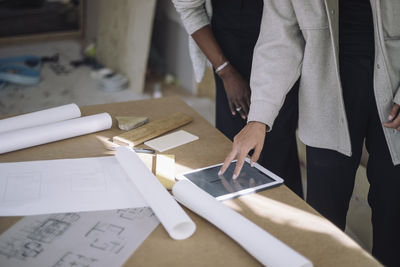 Midsection of man working in office