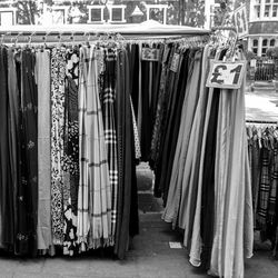 Row of clothes hanging at shop