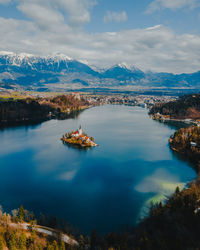 Scenic view of lake and mountains against sky