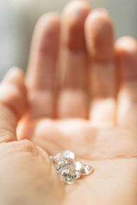 Close-up of human hand holding ring