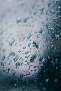 Full frame shot of raindrops on glass window