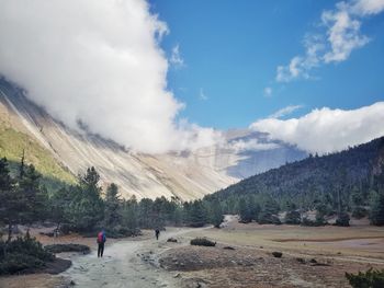 Rear view full length of hiker against mountain at annapurna circuit