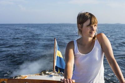 Young woman in boat, sweden