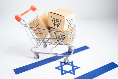 Close-up of shopping cart on table