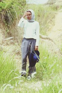 Woman standing on field