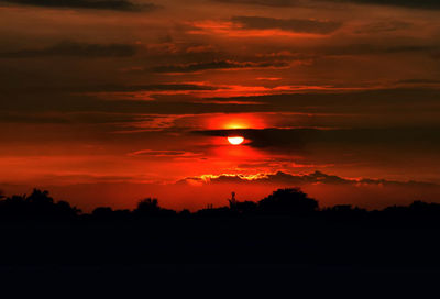 Scenic view of dramatic sky during sunset