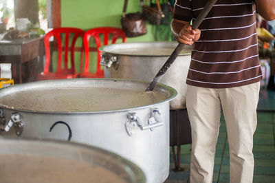 Man cooking food for ceremonial feast