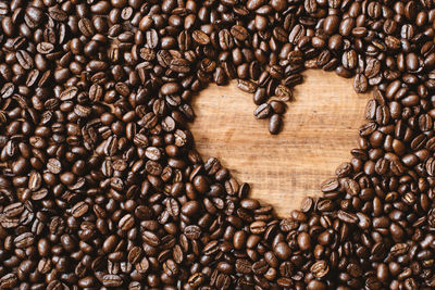 Coffee beans with love shape copy space