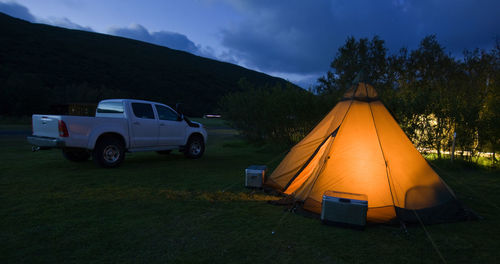 Tent on field against sky