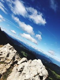 Scenic view of rocky mountains against blue sky
