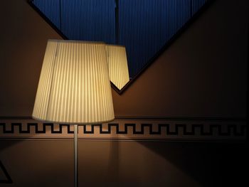 Low angle view of illuminated lamp at home