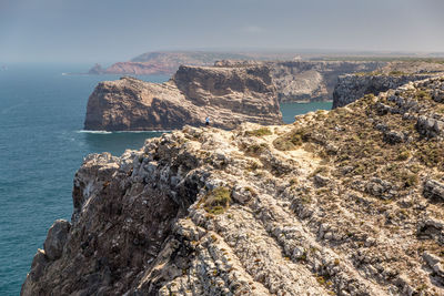 Scenic view of sea and rocks against sky