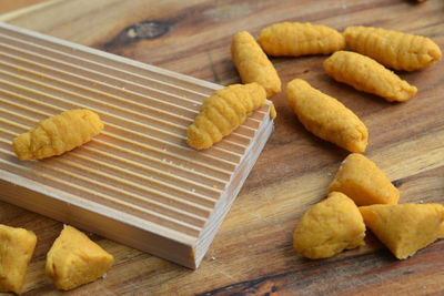 High angle view of bread on cutting board