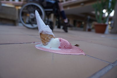 Close-up of ice cream cone on street